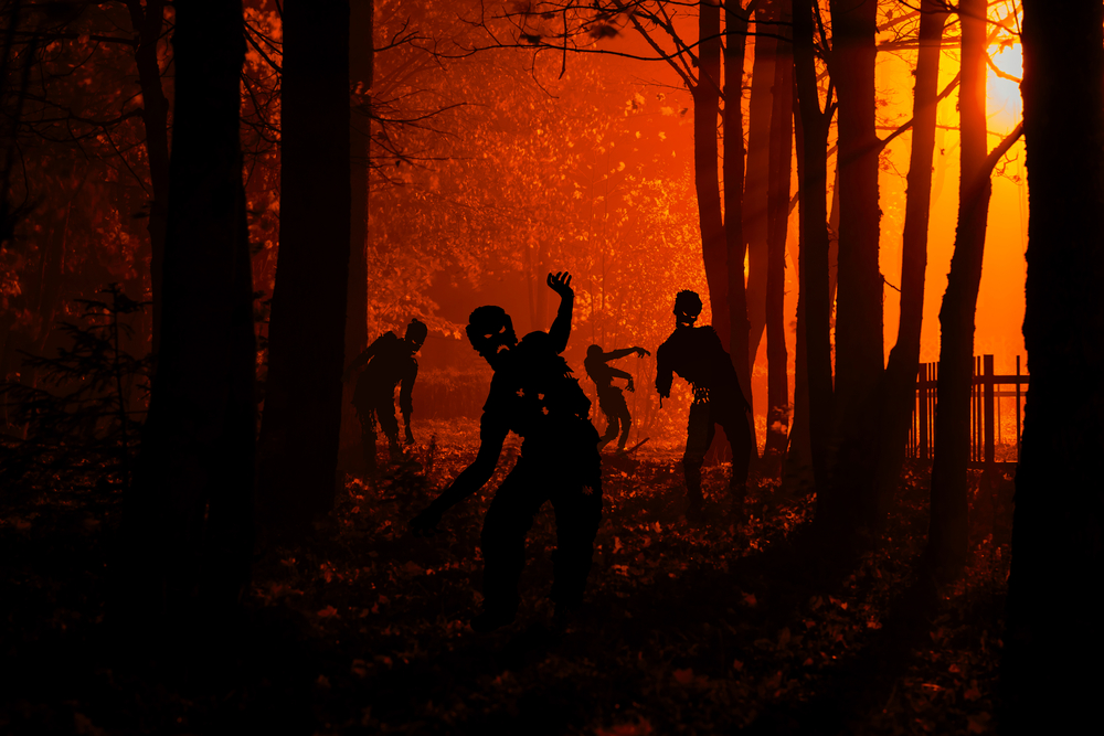 Zombies coming for a runner in the woods. A visual metaphor for story-driven marketing.